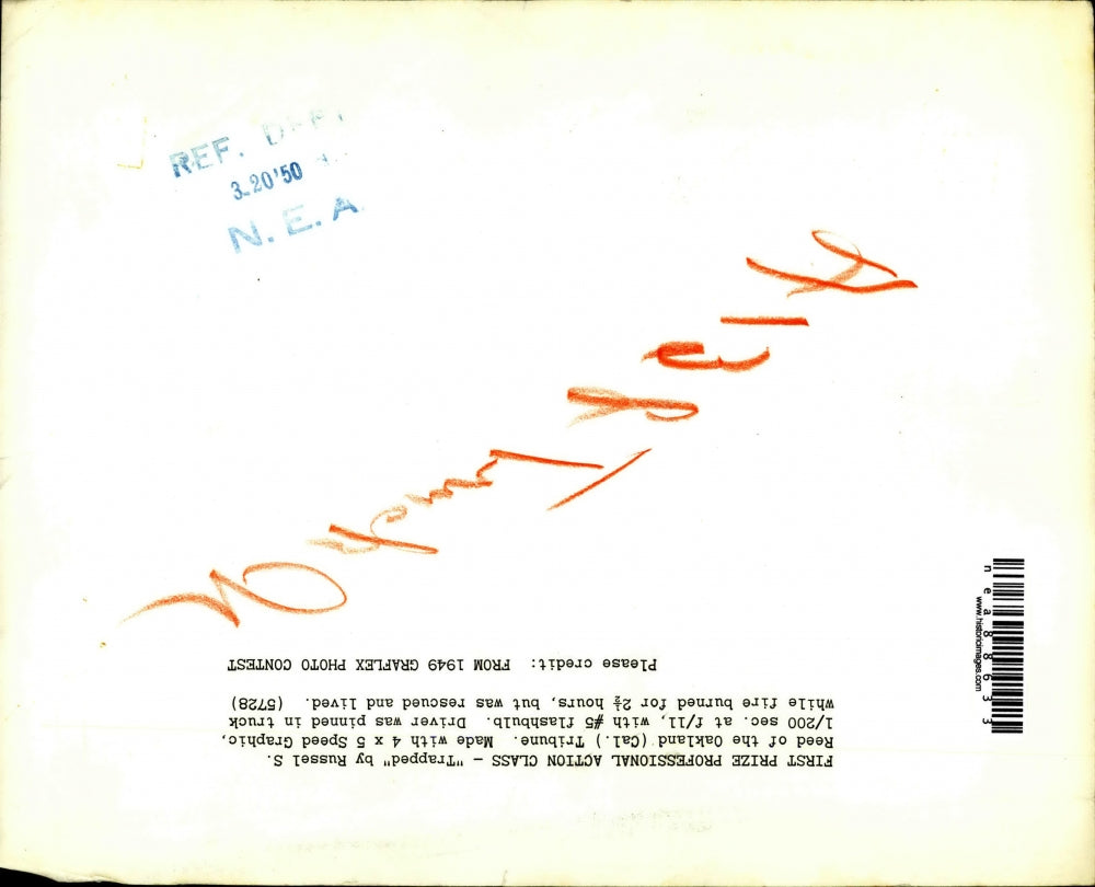 1950 Press Photo A driver pinned in a truck that is on fire - nea88633