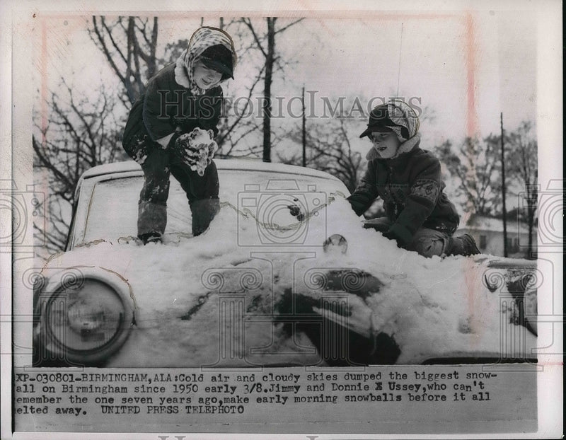 Load image into Gallery viewer, 1957 Press Photo Birmingham Alabama Snow Storm Jimmy and Donnie Ussey
