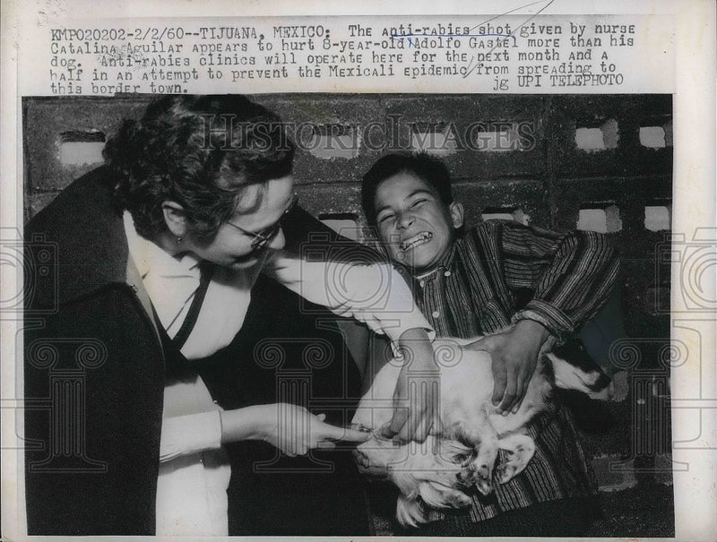 Load image into Gallery viewer, 1960 Press Photo Anti Rabies Shot Given By Catalina Aguilar To 8 Year Old Boy
