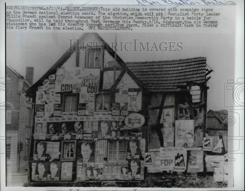 1961 Press Photo Old Building in Seigen, Germany Covered in Election Signs