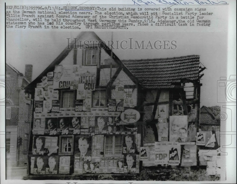 Load image into Gallery viewer, 1961 Press Photo Old Building in Seigen, Germany Covered in Election Signs
