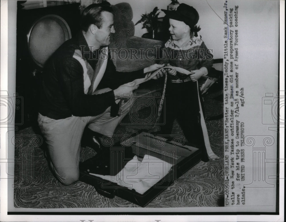 1955 Press Photo Hank Bauer Jr Helps Father New York Yankee Hank Bauer Pack