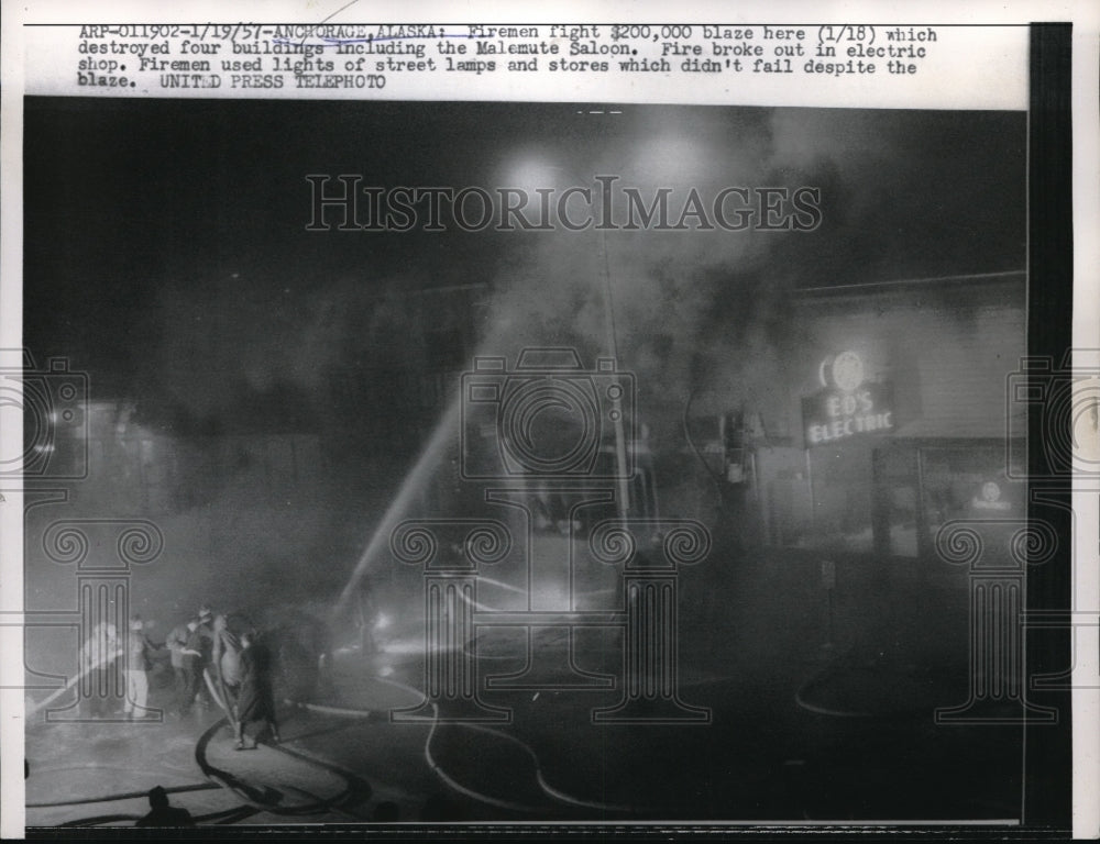 1957 Press Photo Fighting a $200,000 blaze destroyed the Malemute Saloon- Historic Images