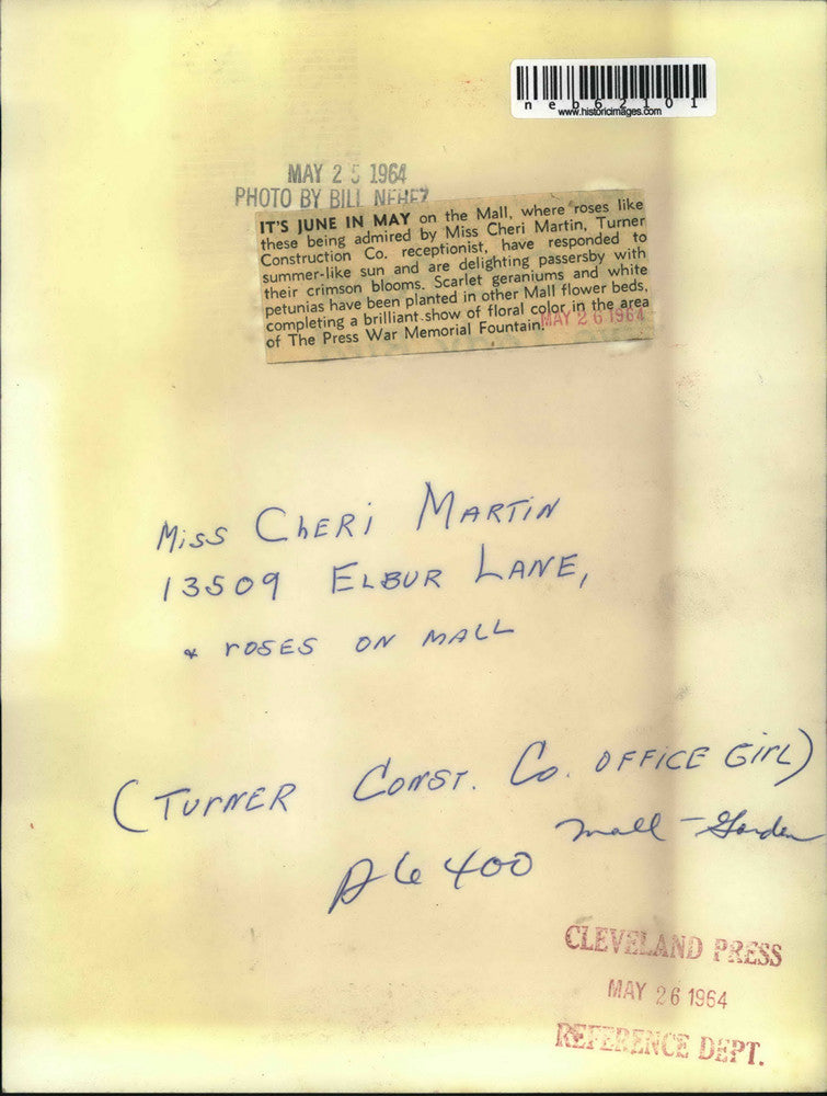 1964 Press Photo Cheri Martin admires spring blooms on Cleveland's Mall, Ohio