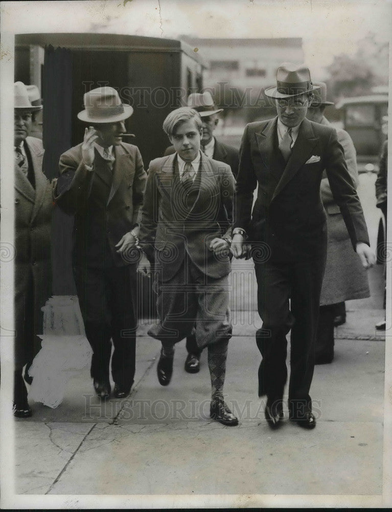 Load image into Gallery viewer, 1933 Press Photo 16 year old Henry Murch on trial for murder escorted into court
