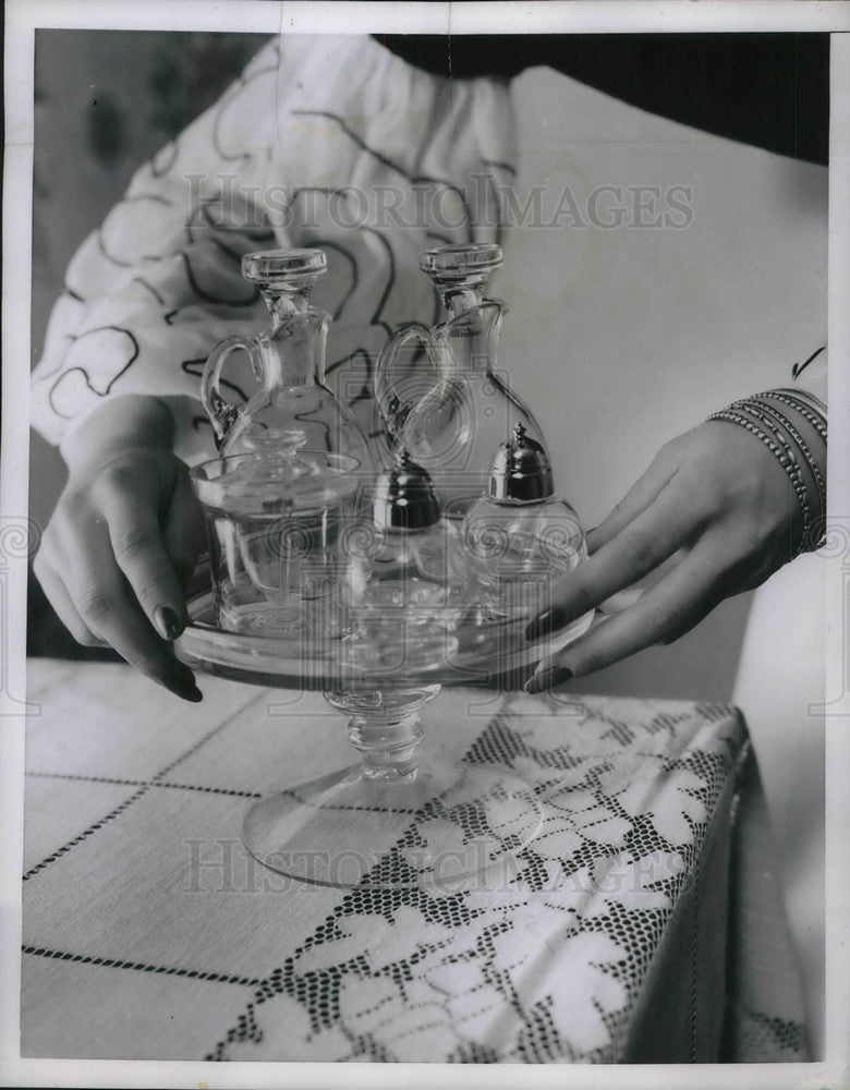 1951 Press Photo Crystal condiment bottles & a stand on display - neb62805