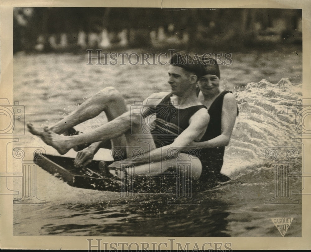 1925 Press Photo A man & woman on a water surfing gizmo in a lake - neb63999- Historic Images