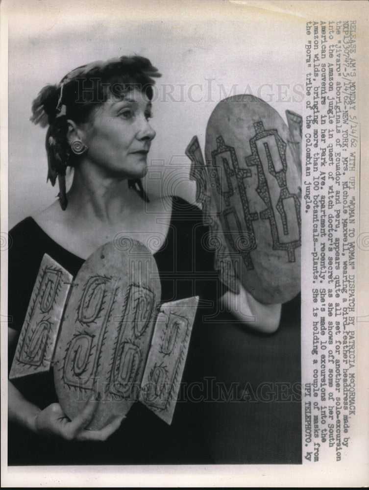Load image into Gallery viewer, 1962 Press Photo Nichole Maxwell wears bird feather headdress
