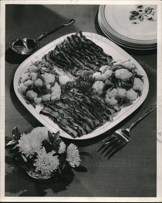 Press Photo Bacon served with two garden vegetables