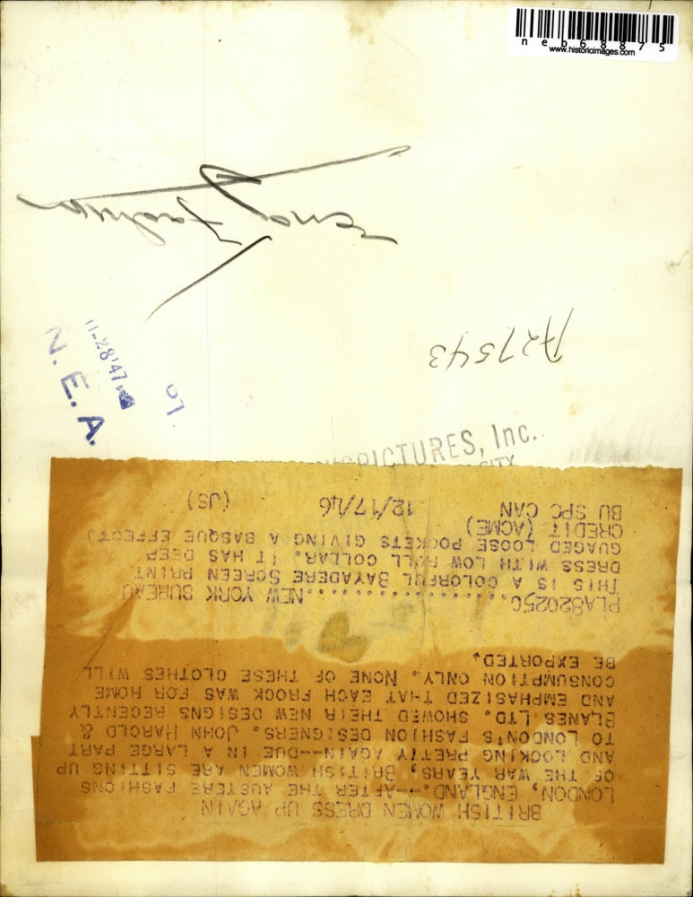 1946 Press Photo Colorful Bayadere Screen Print Dress with low roll collar