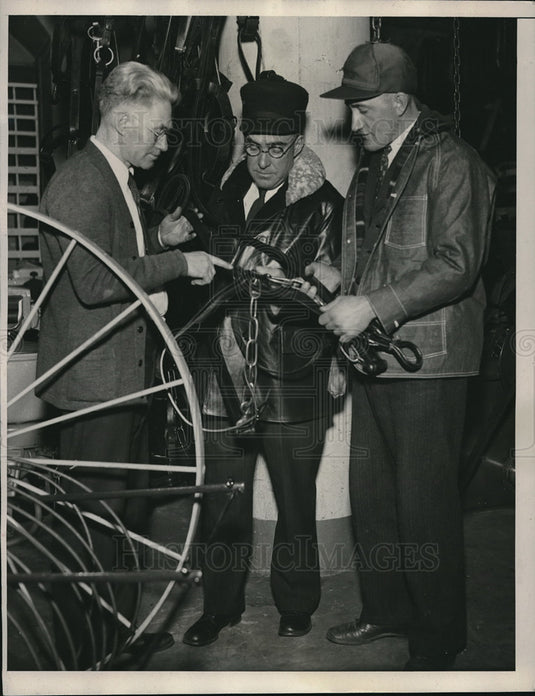1933 Press Photo Salesman Curt Tucker selling harness to farmers - Historic Images