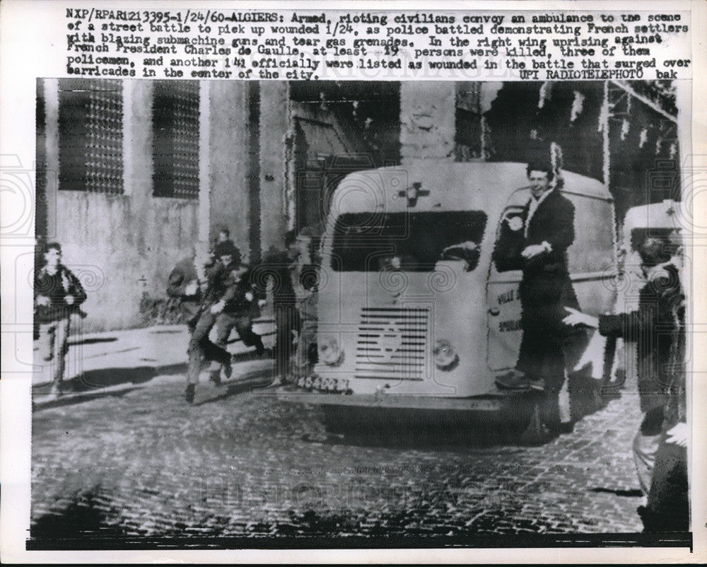 1960 Press Photo Armed civilians escort an ambulance to site of riots in Algiers