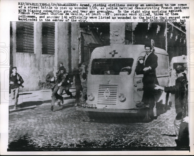 Load image into Gallery viewer, 1960 Press Photo Armed civilians escort an ambulance to site of riots in Algiers
