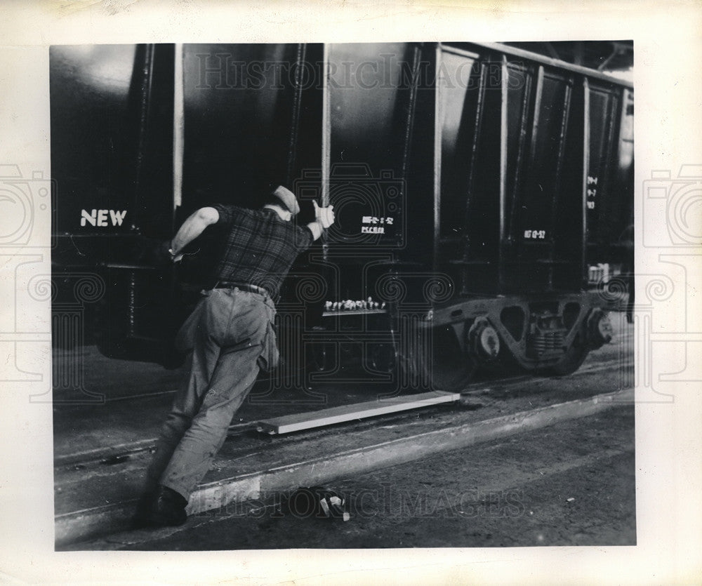 1953 Press Photo Worker demonstrate the ease with Timken-Roller-Bearing-Equipped- Historic Images