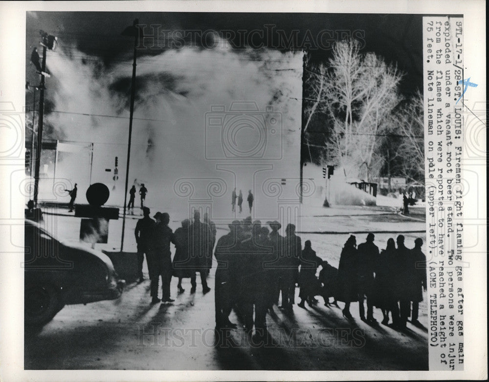 1951 Press Photo Firemen Fighting Gas Fire after Gas Main Exploded Vacant Stand- Historic Images