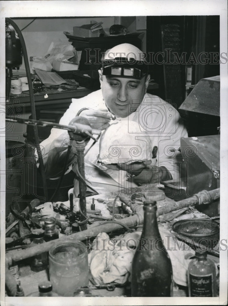 Load image into Gallery viewer, 1946 Press Photo Irving Goldman in his laboratory creating a skullcap
