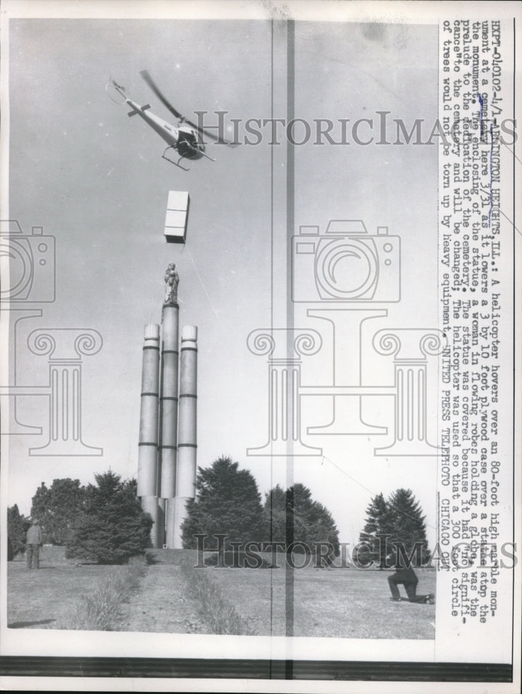 1958 Press Photo Helicopter Hovers Over Marble Monument to Cover Statue