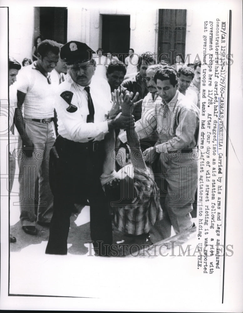 1960 Press Photo Caracas Venezuela Injured Demonstrator - Historic Images