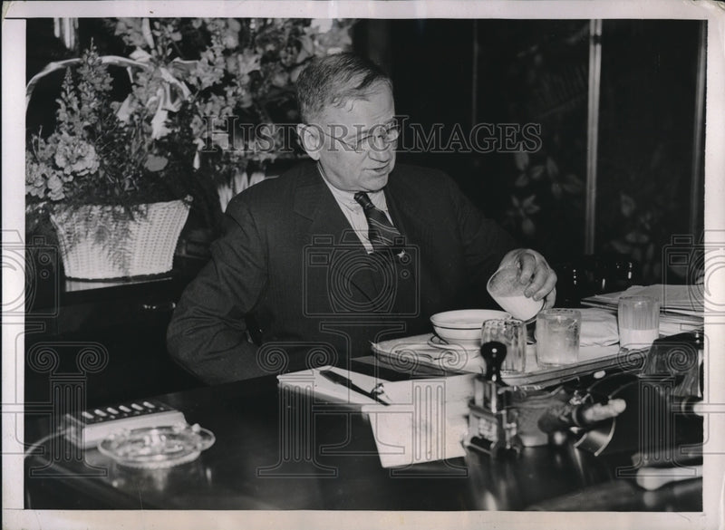 Load image into Gallery viewer, 1937 Press Photo Secretary of the Interior Harold Ickes Eating Lunch at His Desk
