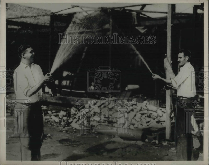 Load image into Gallery viewer, 1929 Press Photo Detroit Customs Patrol Agents In A Playful Moment Squirting
