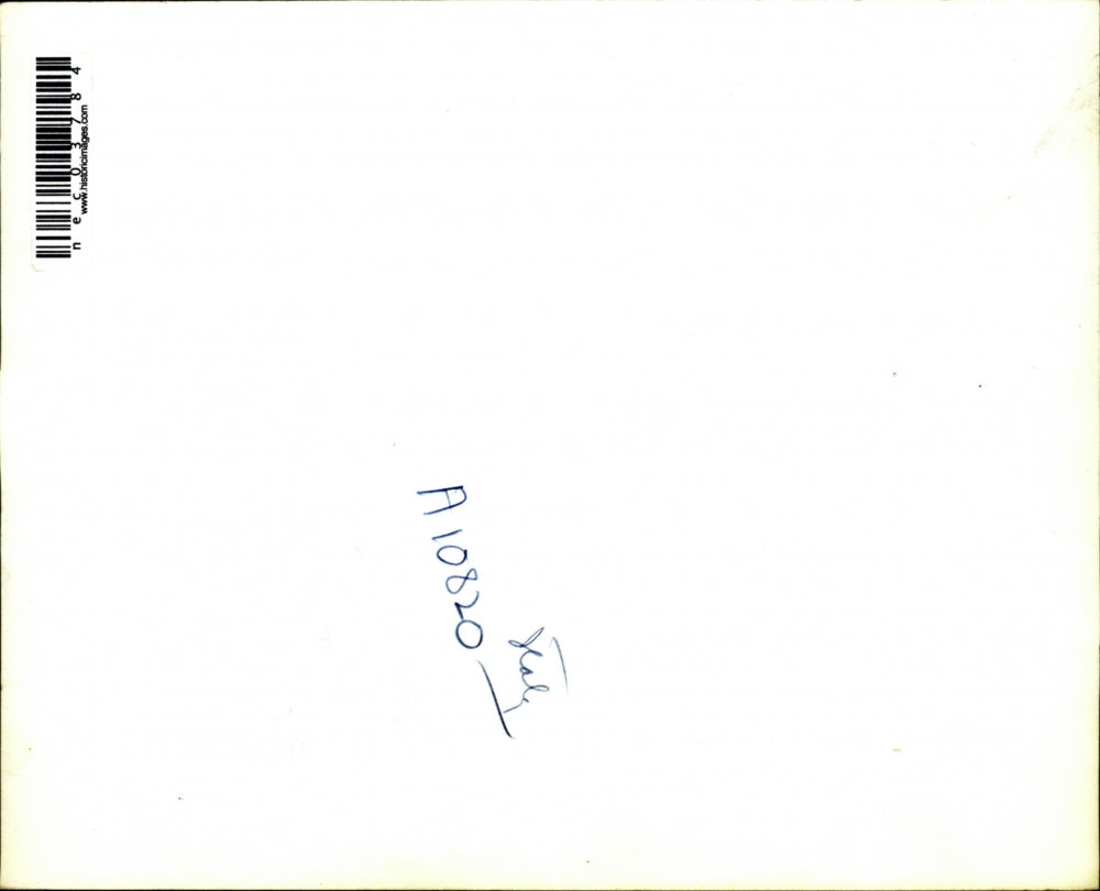 Press Photo Wearing A Man's Coat With Collar Turned Up & Sleeves Turned Back