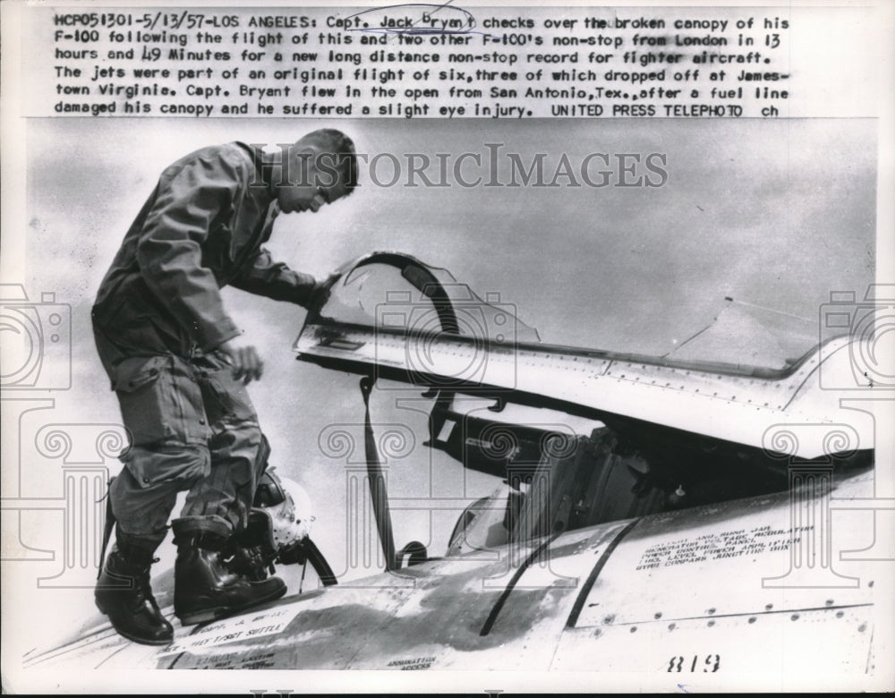1957 Press Photo Captain Jack Bryant Checks Broken Plane Canopy - nec07461