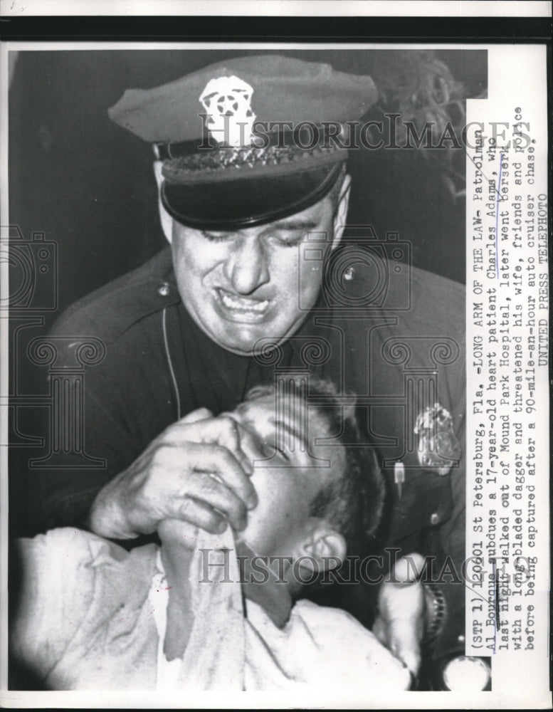 1956 Press Photo St Petersburg, Fla Patrolman Al Bourque subdues heart patient