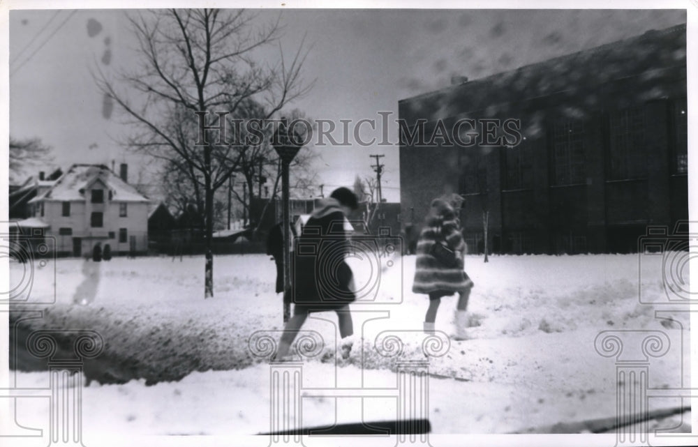 1968 Press Photo Mini Skirted High School Girls Trudging Through Snow- Historic Images