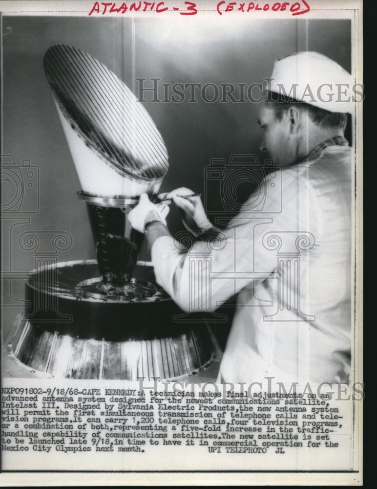 1966 Press Photo Tech makes final adjustments on Antenna Intelsat III