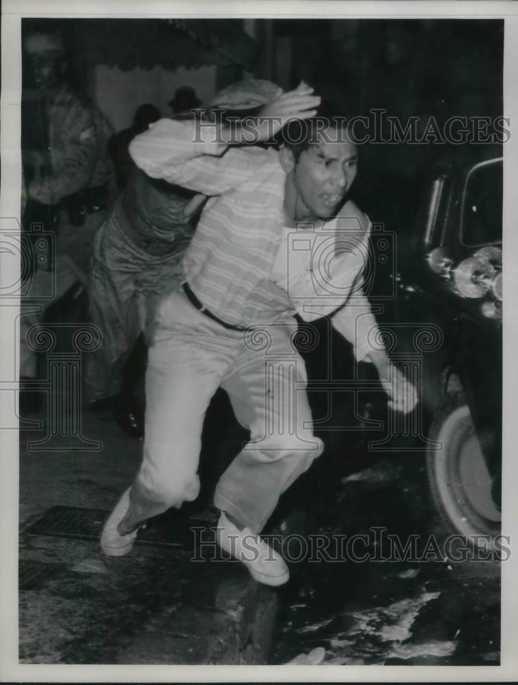 1961 Press Photo Police Go After Demonstrator in Cuidad Trujillo