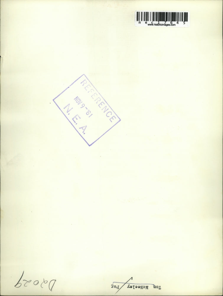 1961 Press Photo Boxer Tom McNeely chops tree