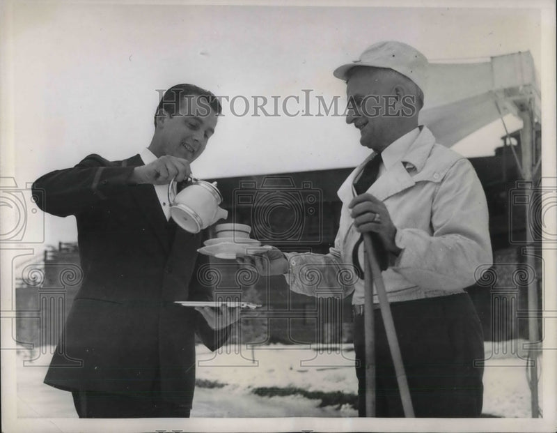 Load image into Gallery viewer, 1937 Press Photo Govenor Barzilla W. Clark of Idaho enjoys tea after ski-ing
