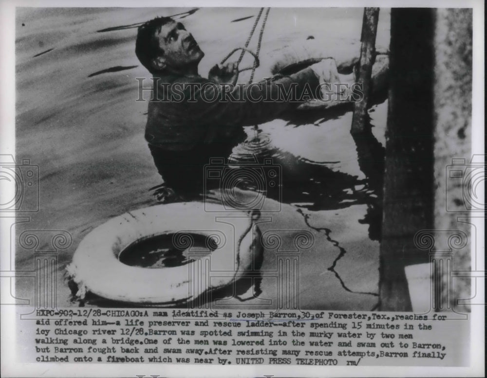 1955 Press Photo Joseph Barron Reaching for Life Preserver Climbing onto boat