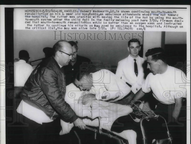 Load image into Gallery viewer, 1960 Press Photo Robert Wadsworth Gives Mouth to Mouth and Saves Son Bobby
