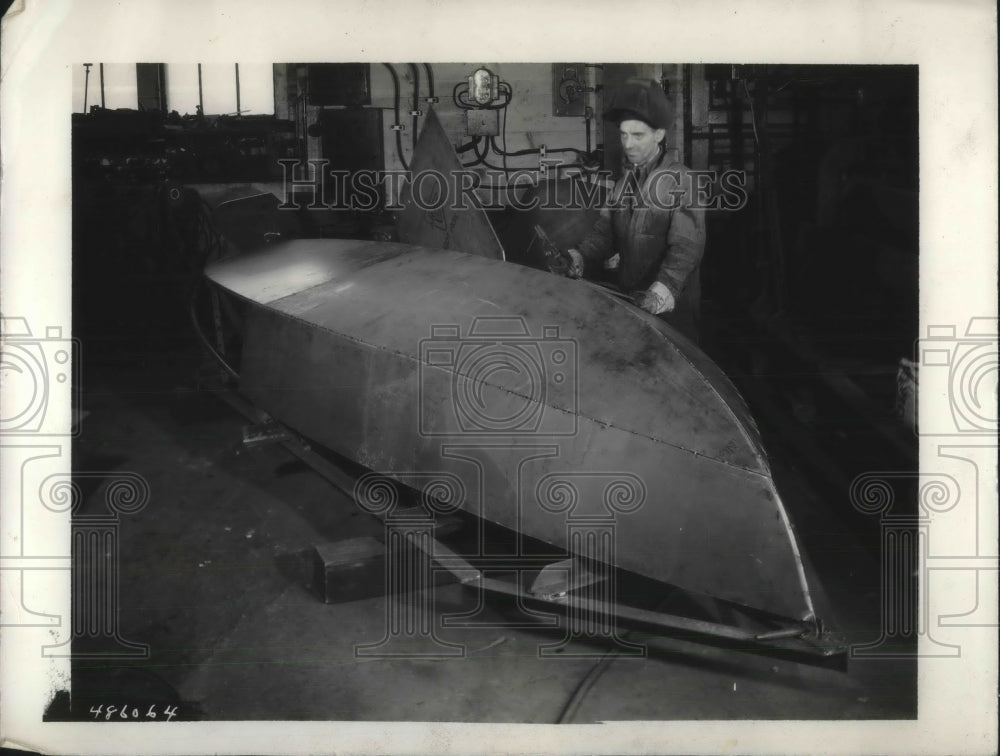 1933 Press Photo Man Builds Small Ship In Shop