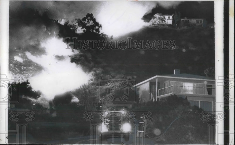 Load image into Gallery viewer, 1956 Press Photo 2 homes on Ramblo Pacifico Rd. surrounded by flames - nec24400
