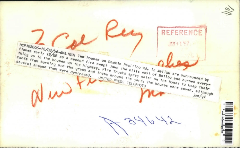 1956 Press Photo 2 homes on Ramblo Pacifico Rd. surrounded by flames - nec24400