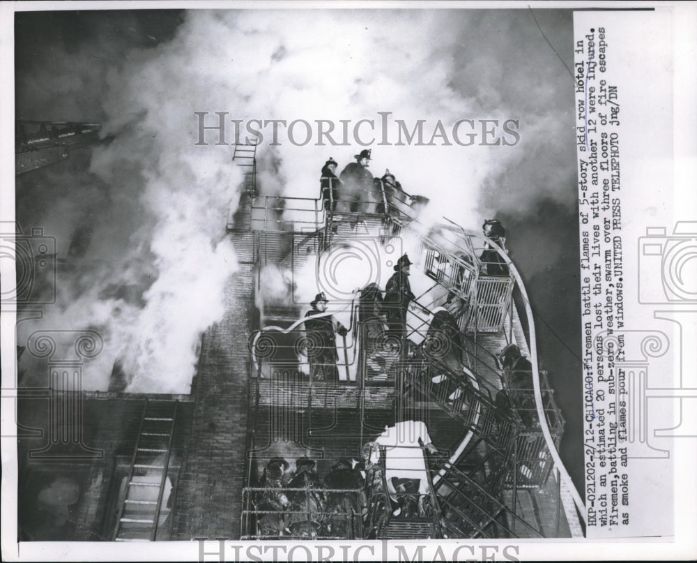 1955 Press Photo Firemen battles flames of a 5-story Skid Row Hotel.