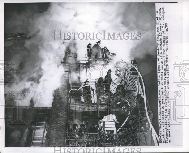 Load image into Gallery viewer, 1955 Press Photo Firemen battles flames of a 5-story Skid Row Hotel.
