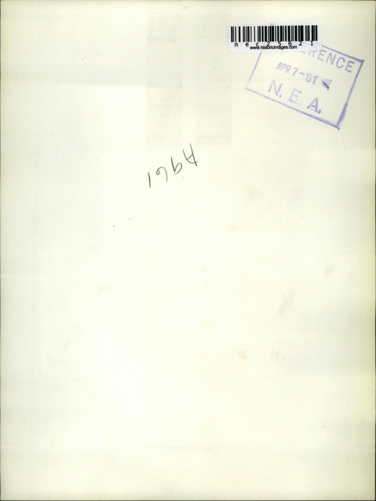 1961 Press Photo Mike Nelan sits on top of the after-fin of US atomic submarine