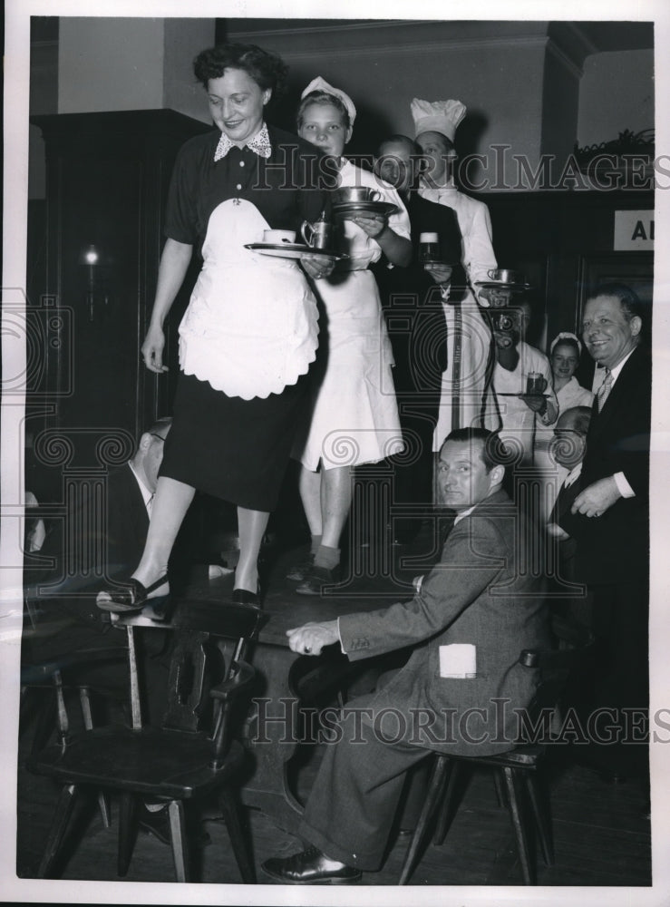 Load image into Gallery viewer, 1953 Press Photo Waitresses Walk On Top Of Tables In Berlin Germany For Race

