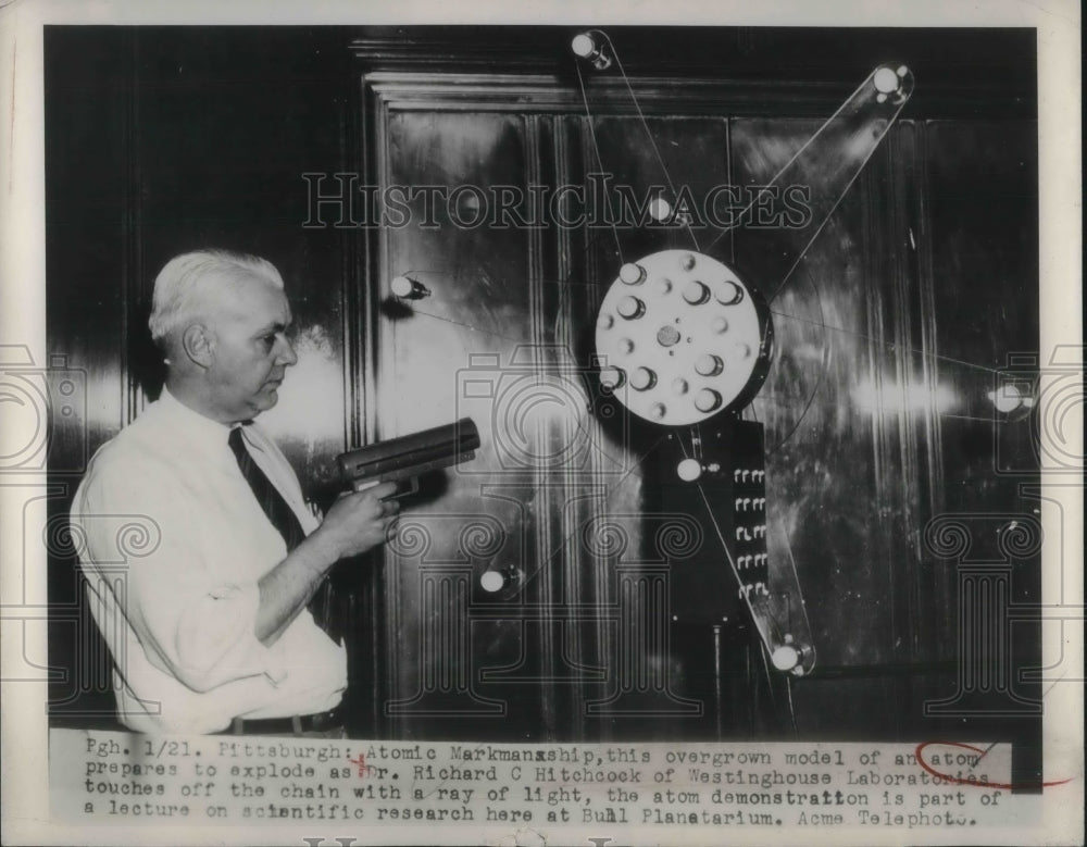 1949 Press Photo Dr. Richard C. Hitchcock with model of an atom.