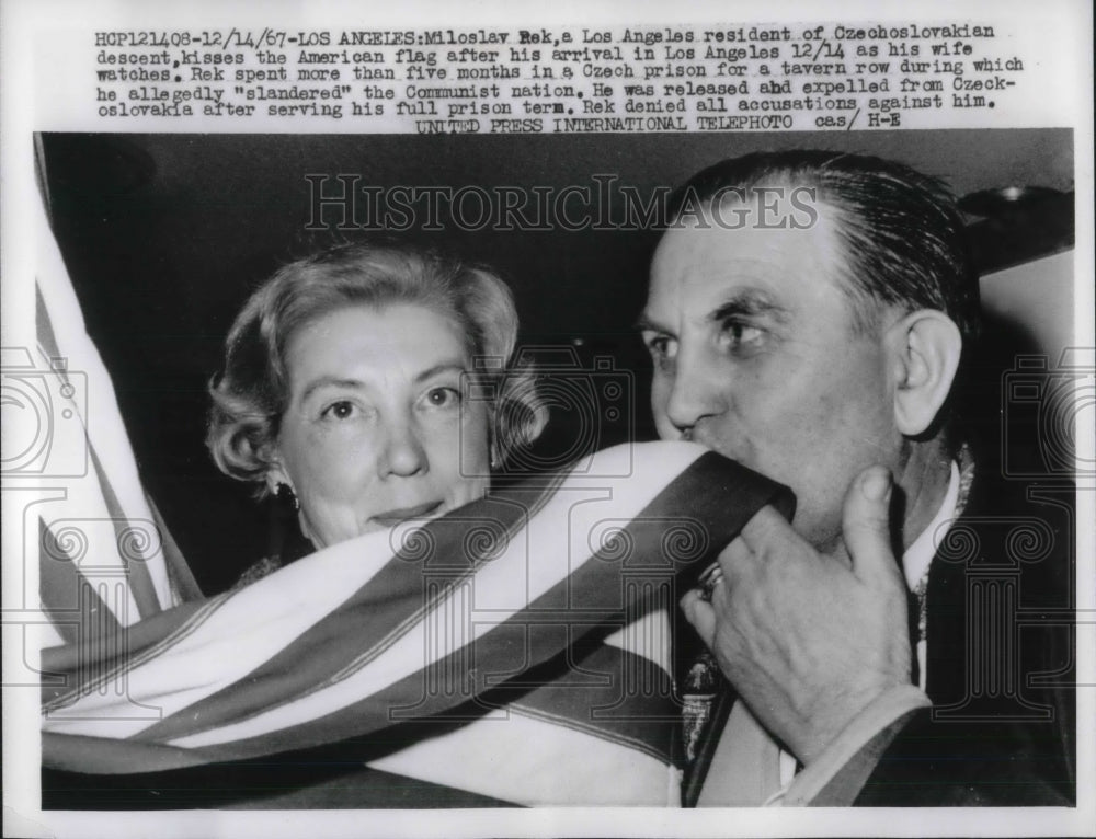 1967 Press Photo Miloslay Rek Kisses the American flag after arrival in LA