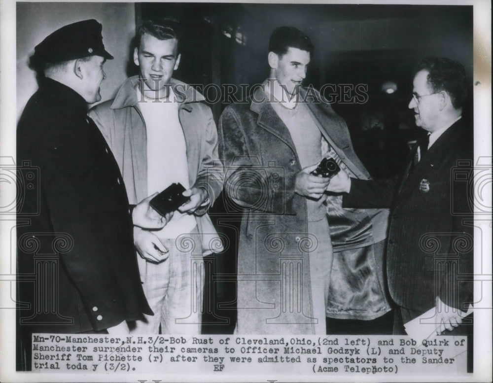 1950 Press Photo Bob Rust and Bob Quirk, surrender their cameras. New Hampshire
