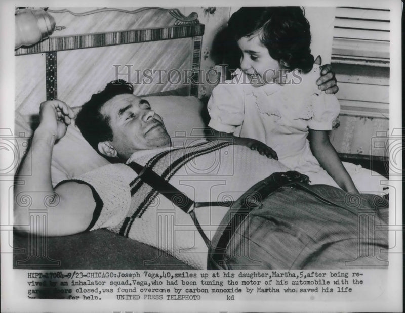 Load image into Gallery viewer, 1952 Press Photo Josepeh Vega smiles at his daughter Martha . Carbon Monoxide.
