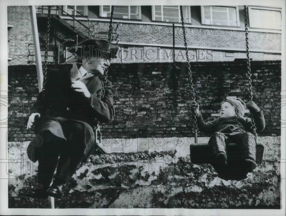 1962 Press Photo Grandpa Woodage Plays On Swing Set With Granddaugther Susan