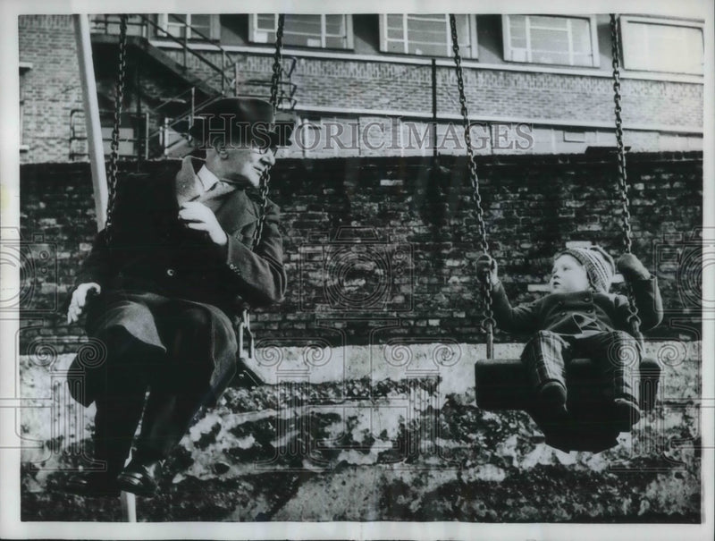 Load image into Gallery viewer, 1962 Press Photo Grandpa Woodage Plays On Swing Set With Granddaugther Susan
