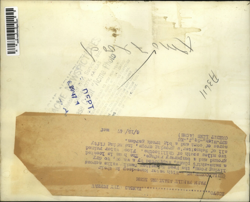 1947 Press Photo Fred Schneiter family walks across make-shift plank. flood.