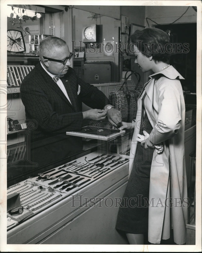 1963 Press Photo customer looking at watches in a jewelry store - nec31742