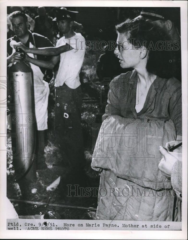 1951 Press Photo Marie Payne, mother at side of well.